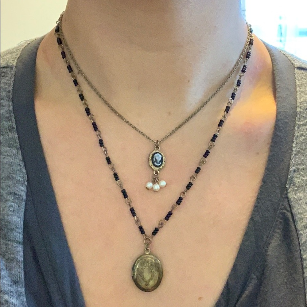 Gold double necklace with locket and cameo